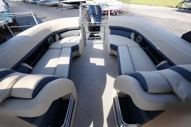 Slide: The Image of 2026 Harris Grand Mariner 250 pontoon boat with spacious seating and modern design. - 14