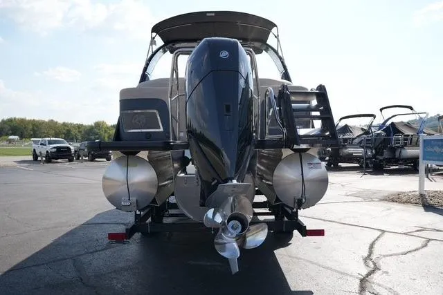 Slide: The Image of 2026 Harris Grand Mariner 250 pontoon boat with powerful outboard motor, parked on asphalt. - 6