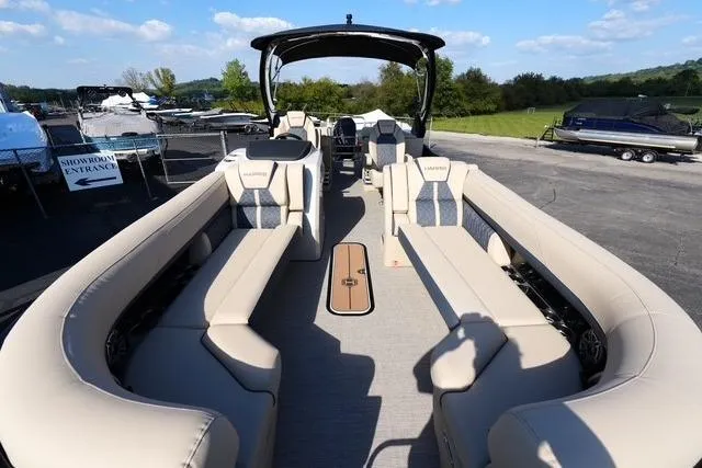 Slide: The Image of 2026 Harris Grand Mariner 250 pontoon boat with spacious seating and modern design. - 8