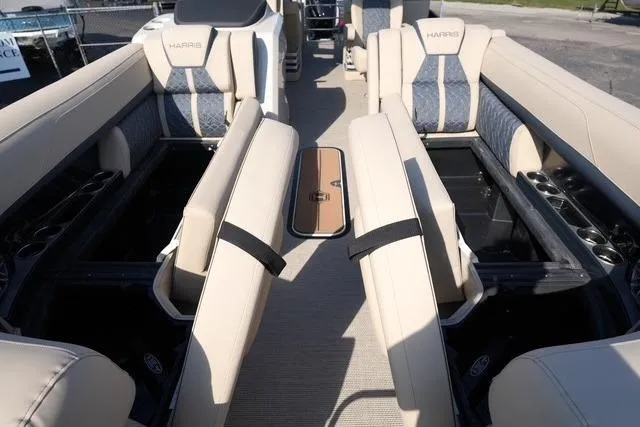 Slide: The Image of 2026 Harris Grand Mariner 250 interior with luxurious seating and storage compartments. - 9