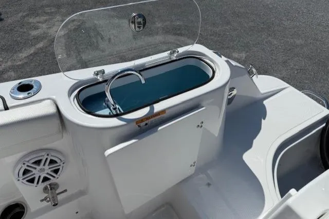 Slide: The Image of 2025 Wellcraft 243 Fisherman boat with open livewell and storage compartment. - 14