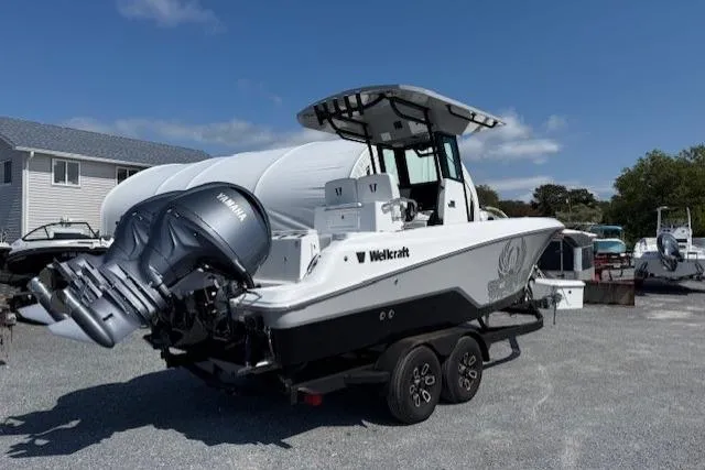Slide: The Image of 2025 Wellcraft 243 Fisherman boat on trailer, featuring Yamaha outboard motor. - 2