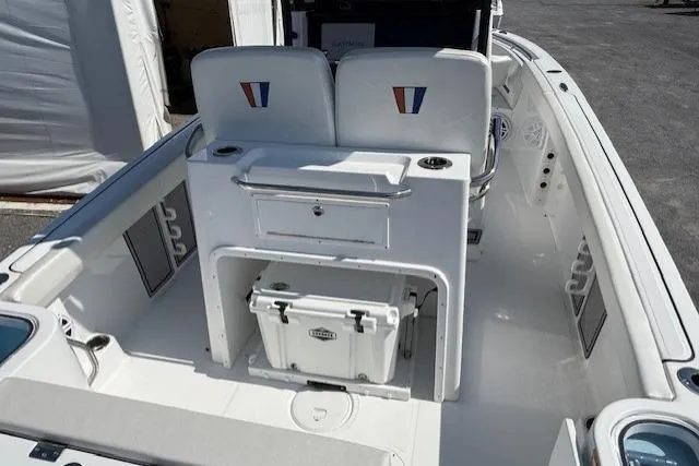 Slide: The Image of 2025 Wellcraft 243 Fisherman boat interior with seating and storage compartments. - 4