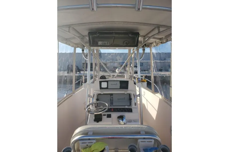 Slide: The Image of 1999 Grady-White Advance 247 boat interior with steering console and navigation equipment. - 12