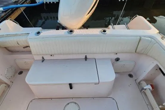 Slide: The Image of 1999 Grady-White Advance 247 boat interior with seating and storage compartments. - 20