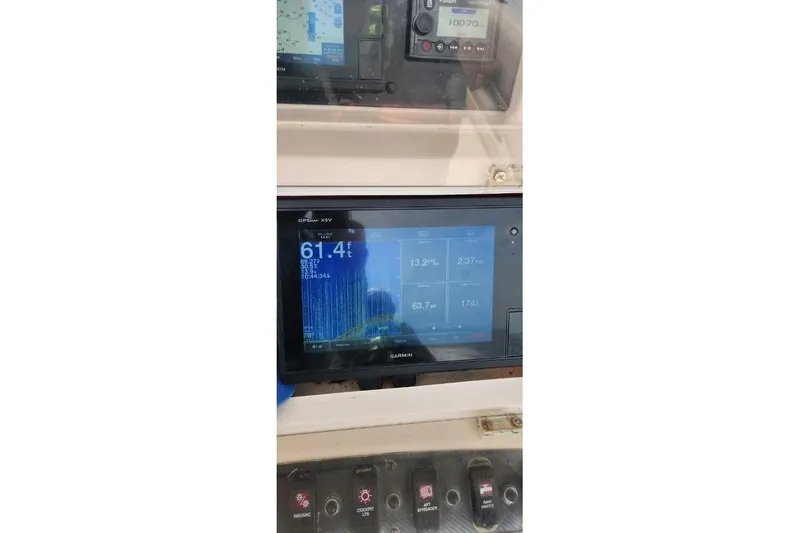 Slide: The Image of 1999 Grady-White Advance 247 boat dashboard with Garmin GPS display. - 22