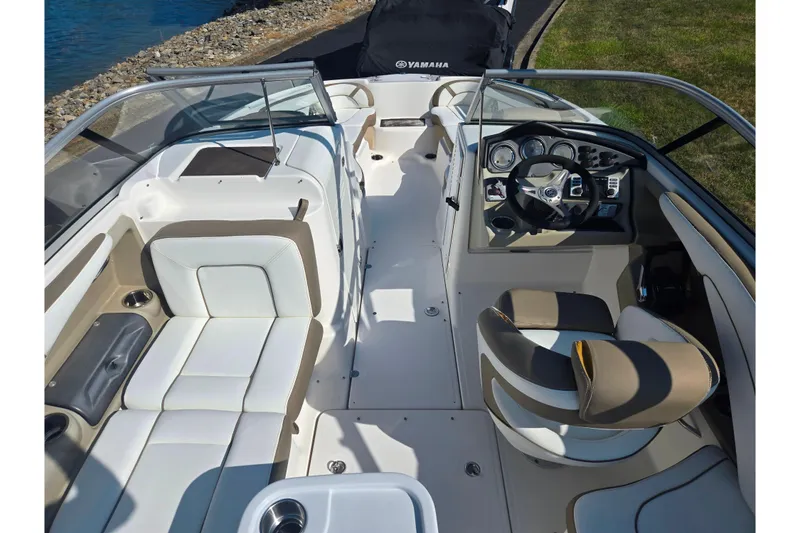 Slide: The Image of 2013 Yamaha Boats 242 Limited S interior with sleek seating and modern dashboard design. - 12