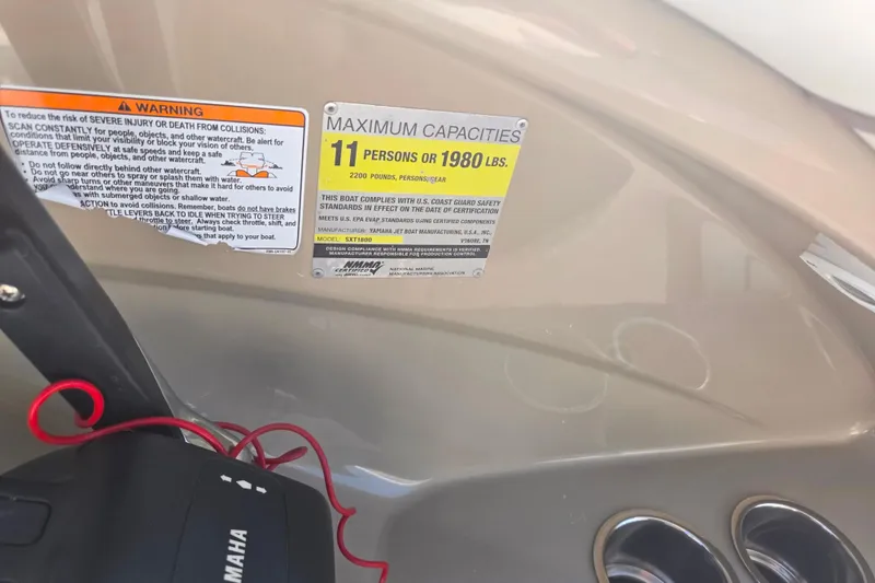 Slide: The Image of 2013 Yamaha Boats 242 Limited S capacity warning labels and safety instructions. - 14