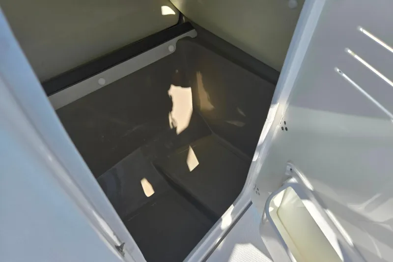 Slide: The Image of Storage compartment inside 2013 Yamaha Boats 242 Limited S, showcasing interior space. - 17