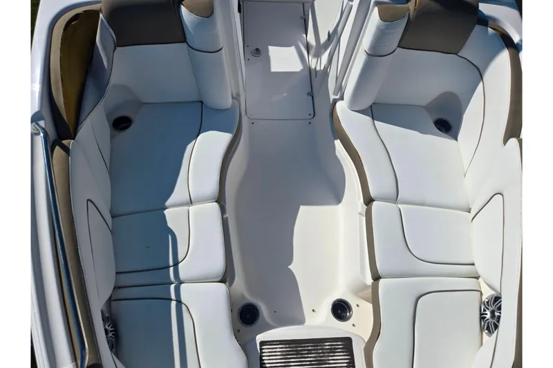 Slide: The Image of 2013 Yamaha Boats 242 Limited S interior with white cushioned seating. - 20