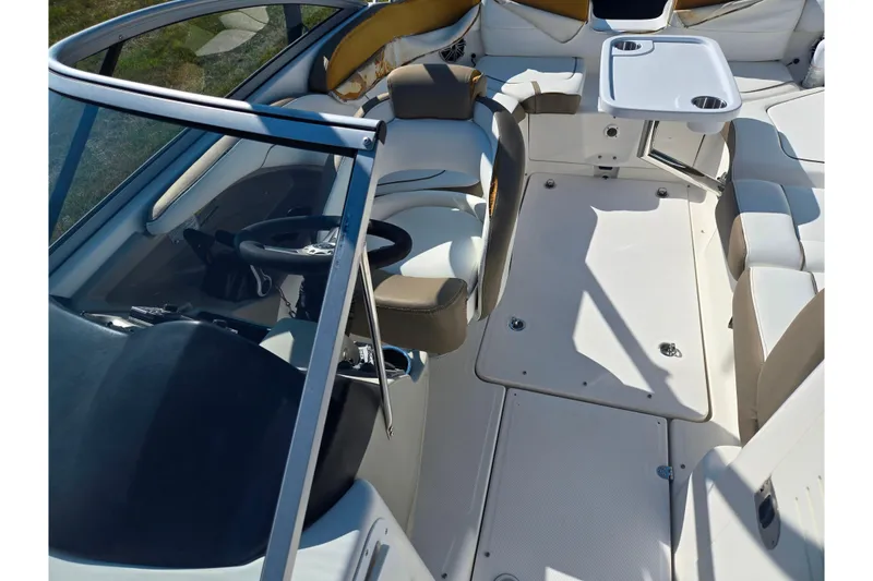 Slide: The Image of 2013 Yamaha Boats 242 Limited S interior with seating and table setup. - 22