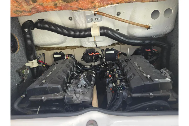 Slide: The Image of Engine compartment of 2013 Yamaha Boats 242 Limited S, showcasing dual high-output engines. - 25