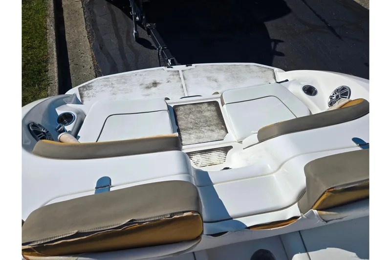 Slide: The Image of 2013 Yamaha Boats 242 Limited S interior with seating and cup holders. - 26