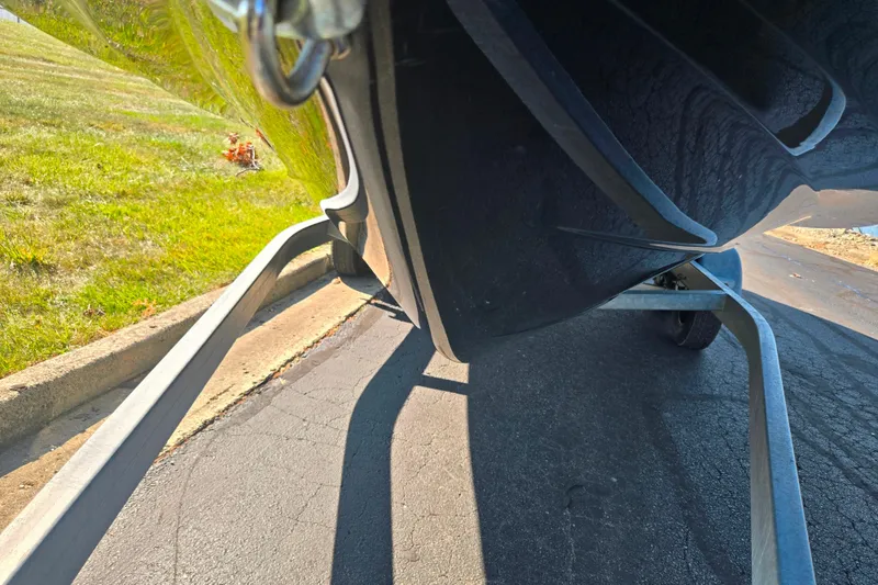 Slide: The Image of 2013 Yamaha Boats 242 Limited S on trailer, showing hull and trailer details. - 7