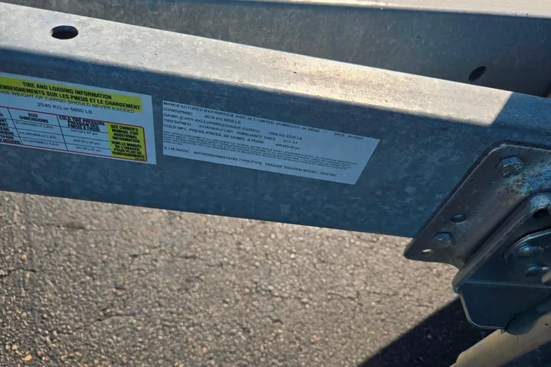 Slide: The Image of Trailer frame with tire and loading information labels, suitable for 2013 Yamaha Boats 242 Limited S. - 8