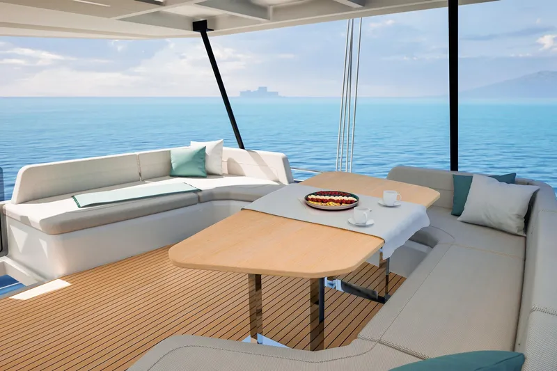 Slide: The Image of Luxurious 2026 Fountaine Pajot 55 yacht deck with elegant seating and ocean view. - 6