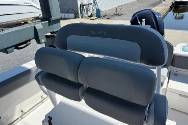 Slide: The Image of 2023 NauticStar 242L Offshore boat seating, featuring gray cushioned seats and sleek design. - 10
