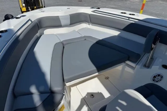 Slide: The Image of 2023 NauticStar 242L Offshore boat interior with cushioned seating area. - 12
