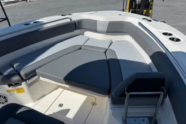 Slide: The Image of 2023 NauticStar 242L Offshore boat with spacious seating and modern design. - 13