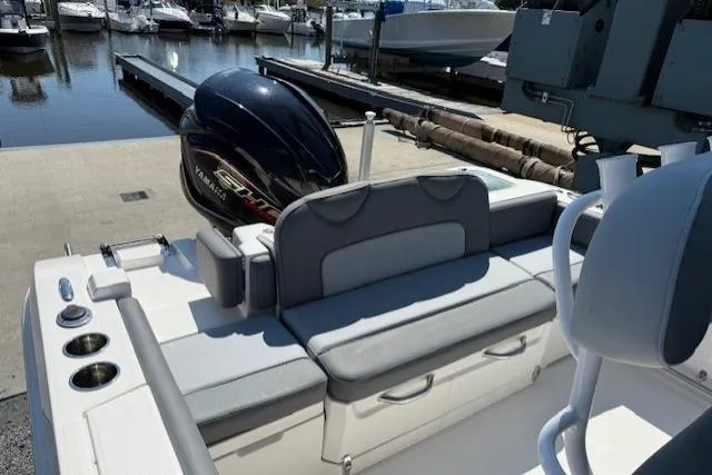 Slide: The Image of 2023 NauticStar 242L Offshore boat with Yamaha engine at marina dock. - 14
