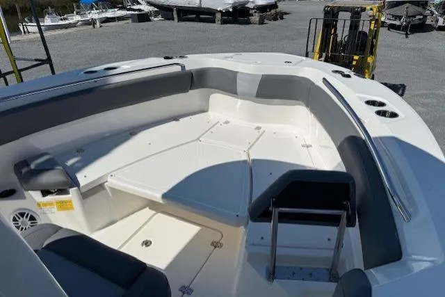Slide: The Image of 2023 NauticStar 242L Offshore boat interior with spacious seating and storage compartments. - 8