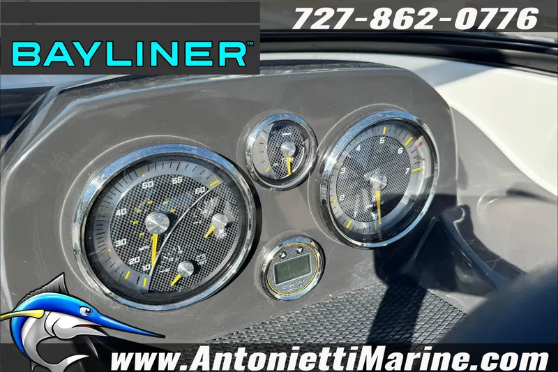 Slide: The Image of Dashboard of 2026 Bayliner VR4 Bowrider OB with gauges and branding. - 16