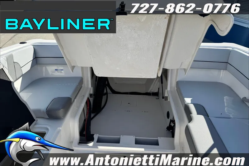 Slide: The Image of 2026 Bayliner VR4 Bowrider OB interior view with seating and storage. - 26