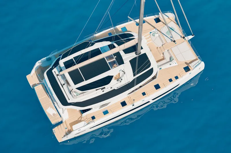 Slide: The Image of Aerial view of 2026 Fountaine Pajot 55 catamaran on clear blue water. - 14