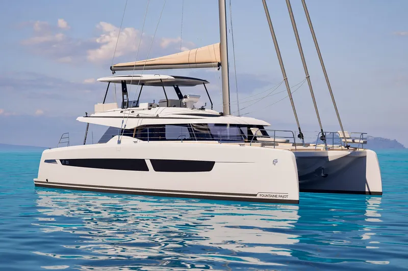 Slide: The Image of 2026 Fountaine Pajot 55 catamaran sailing on clear blue water. - 18