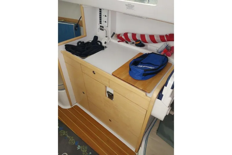 Slide: The Image of Interior of 2014 Catalina 275 Sport sailboat with storage and nautical equipment. - 10