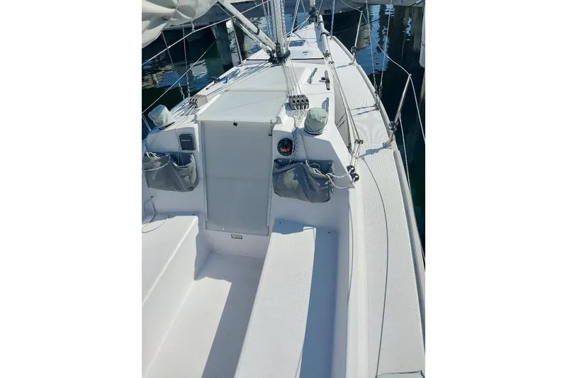 Slide: The Image of 2014 Catalina 275 Sport sailboat deck, featuring clean lines and modern design. - 4