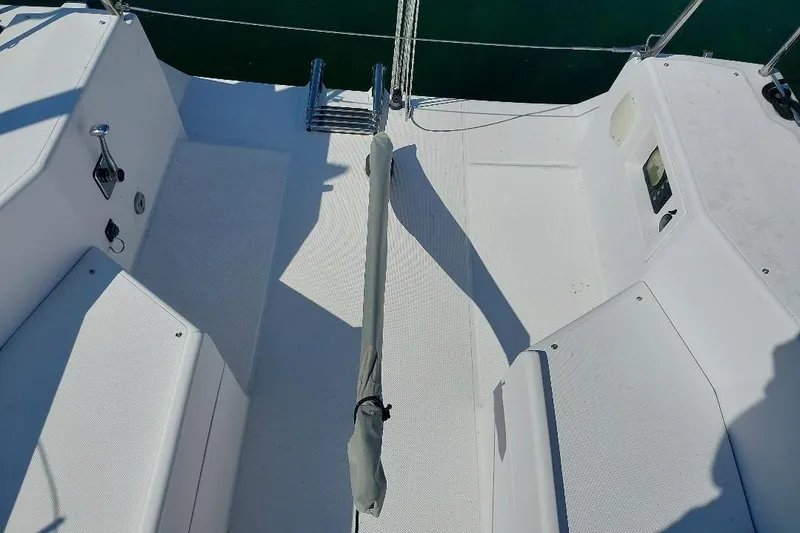 Slide: The Image of Cockpit of 2014 Catalina 275 Sport sailboat with white seating and ladder. - 5