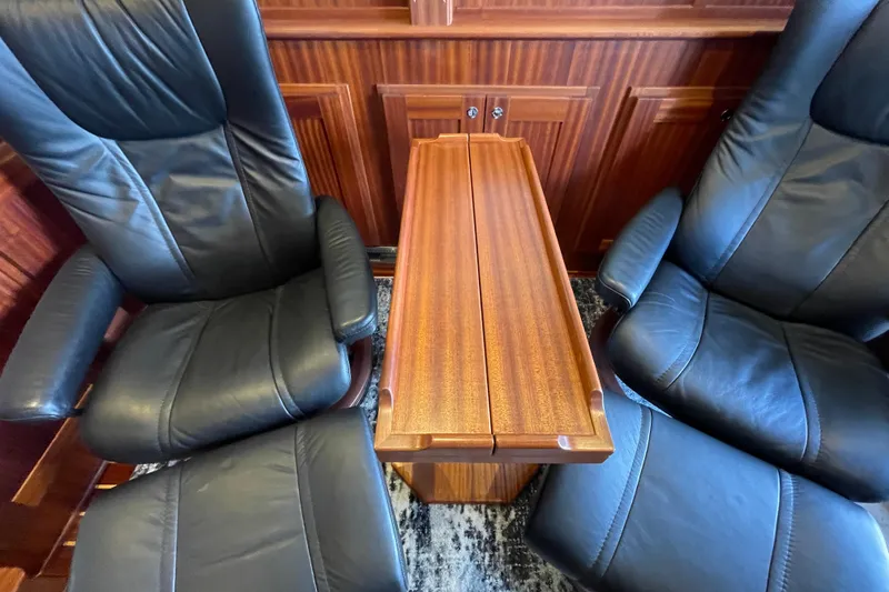 Slide: The Image of Luxurious leather seating and wooden table in 2021 American Tug 362 interior. - 15