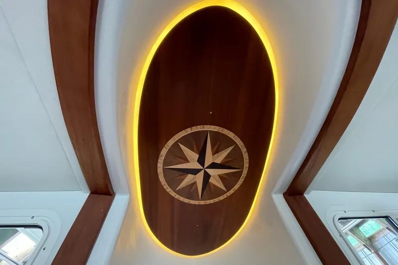 Slide: The Image of Illuminated compass rose design on 2021 American Tug 362 ceiling. - 19