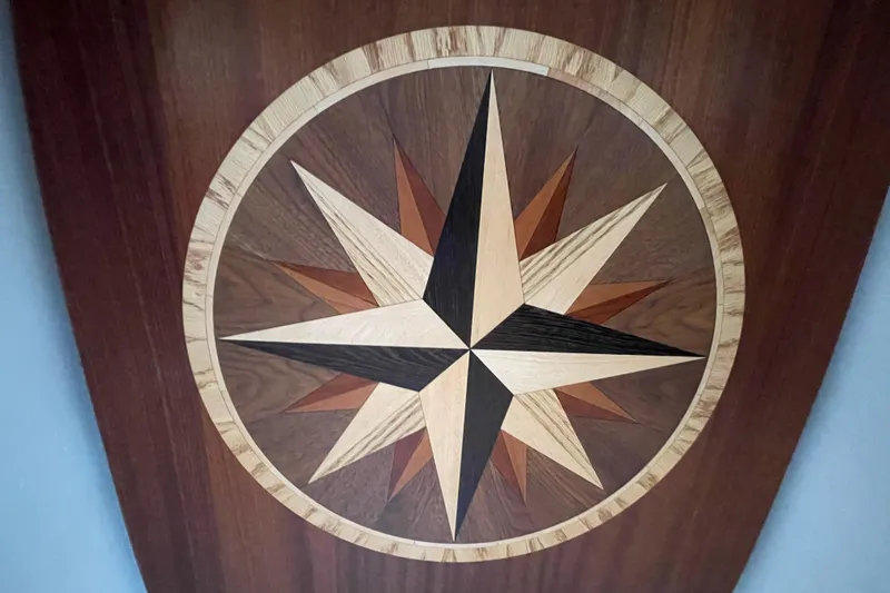 Slide: The Image of Wooden compass rose design on American Tug 362, 2021 model. - 20