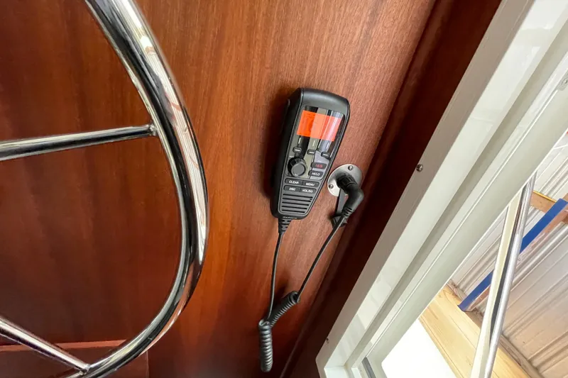 Slide: The Image of Radio handset on American Tug 362, 2021 model, mounted on wooden panel. - 25