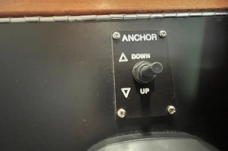 Slide: The Image of Anchor control panel on 2021 American Tug 362 boat, featuring up and down toggle switch. - 28