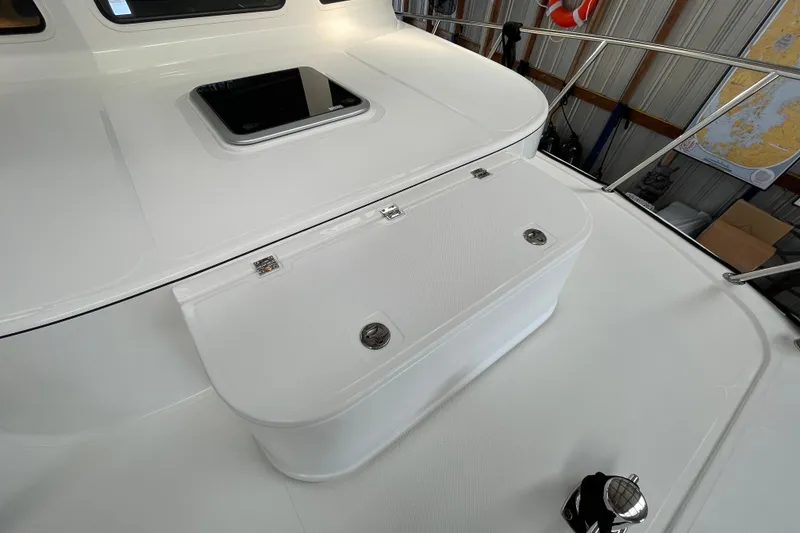 Slide: The Image of 2021 American Tug 362 deck with hatch and railing in a storage facility. - 49