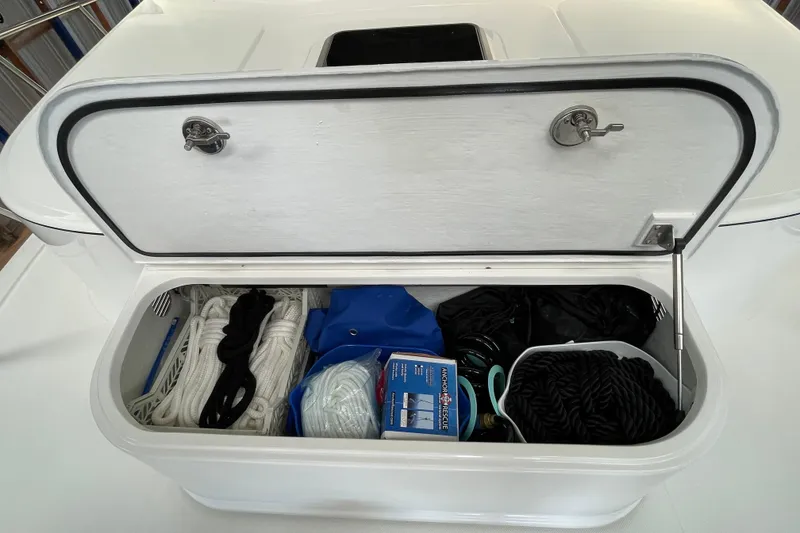 Slide: The Image of Storage compartment on a 2021 American Tug 362, containing ropes and boating supplies. - 50