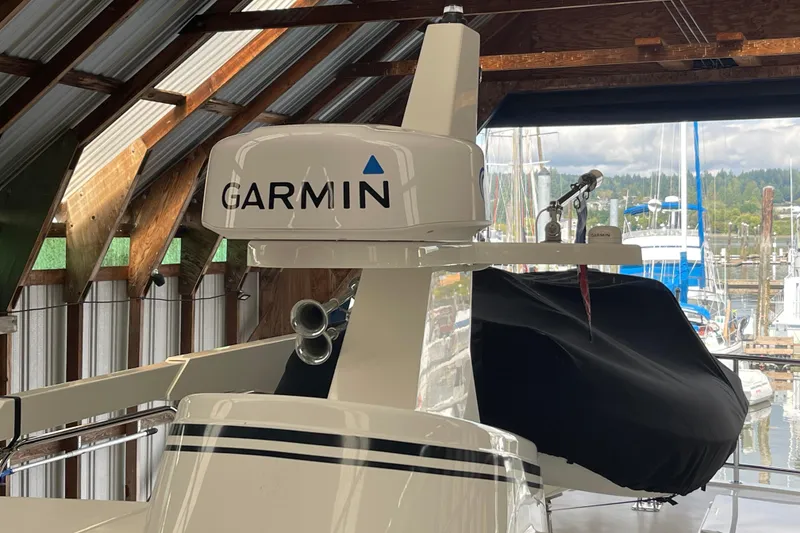 Slide: The Image of 2021 American Tug 362 with Garmin equipment in a marina setting. - 53