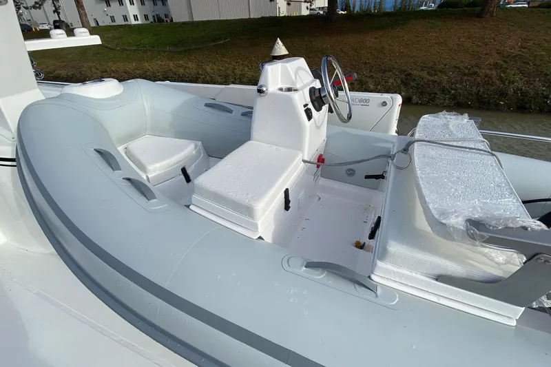 Slide: The Image of 2021 American Tug 362 boat interior with steering wheel and seating area. - 65