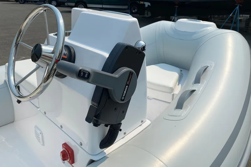 Slide: The Image of Steering console of a 2021 American Tug 362 boat with Yamaha controls. - 68