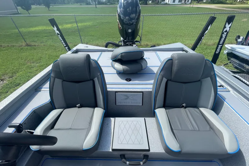 Slide: The Image of 2026 Xpress H20 Bass boat interior with dual seats and steering wheel. - 11