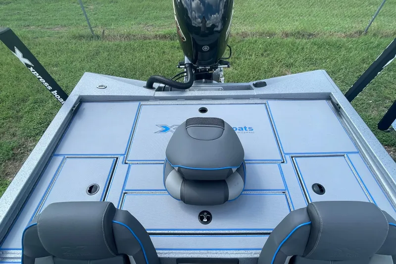 Slide: The Image of 2026 Xpress H20 Bass boat deck with seating and storage compartments. - 12