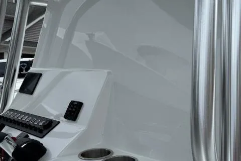 Slide: The Image of 2026 Cape Horn 31 T boat console with controls and cup holders. - 14