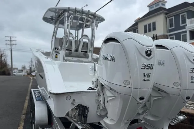 Slide: The Image of 2026 Cape Horn 31 T boat with dual Yamaha 350 engines, parked on a street. - 16