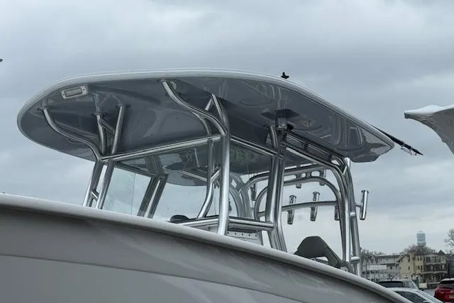 Slide: The Image of 2026 Cape Horn 31 T boat with sleek T-top design against cloudy sky. - 2