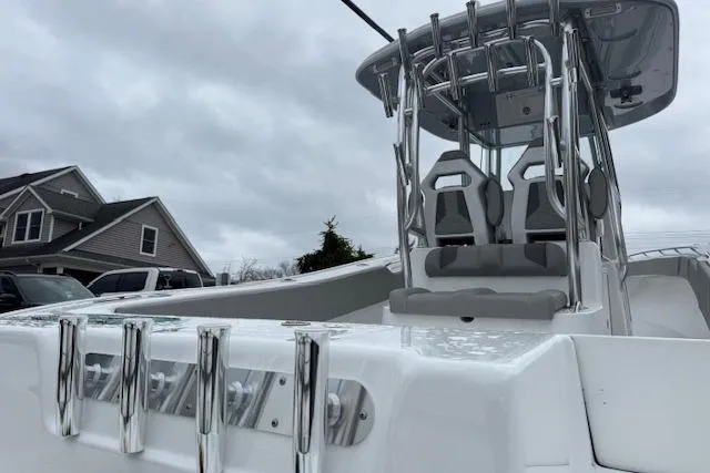 Slide: The Image of 2026 Cape Horn 31 T boat with sleek design and modern seating under cloudy skies. - 18