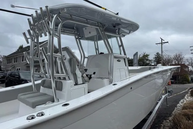 Slide: The Image of 2026 Cape Horn 31 T boat with sleek design and modern features, docked outdoors. - 6