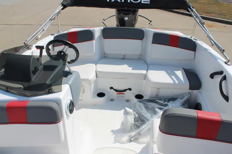 Slide: The Image of 2023 Tahoe T16 boat interior with seating, steering wheel, and modern design. - 12